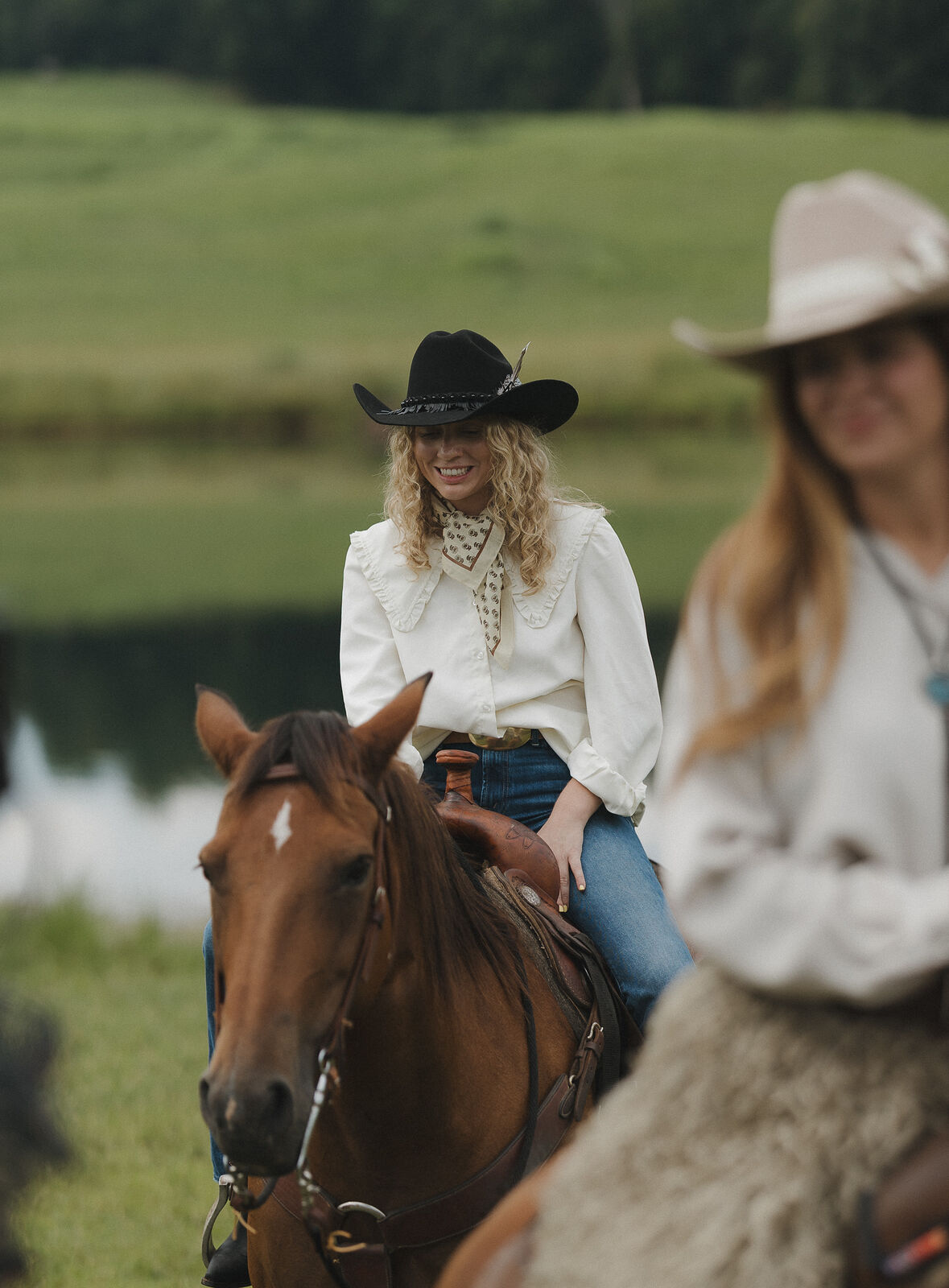 Two women sharing a horse